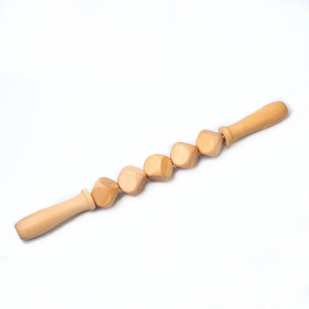 Set of three birch wood anti-cellulite massage hand rollers on a white background