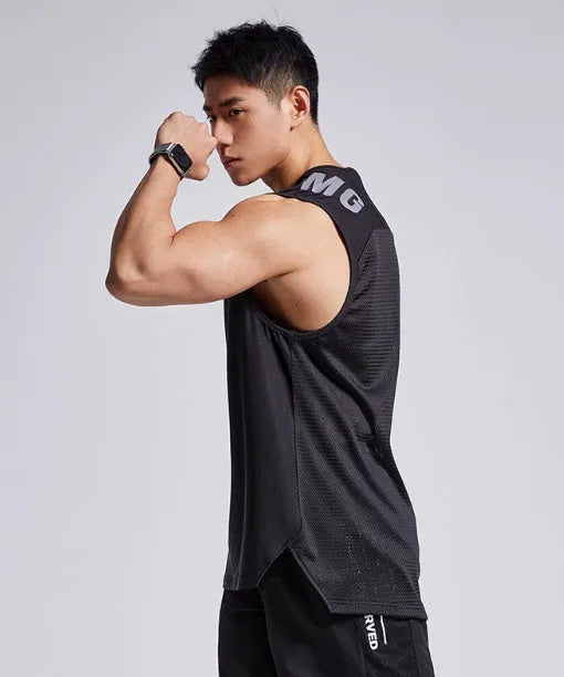 Man wearing a lightweight grey mesh sports vest for fitness training