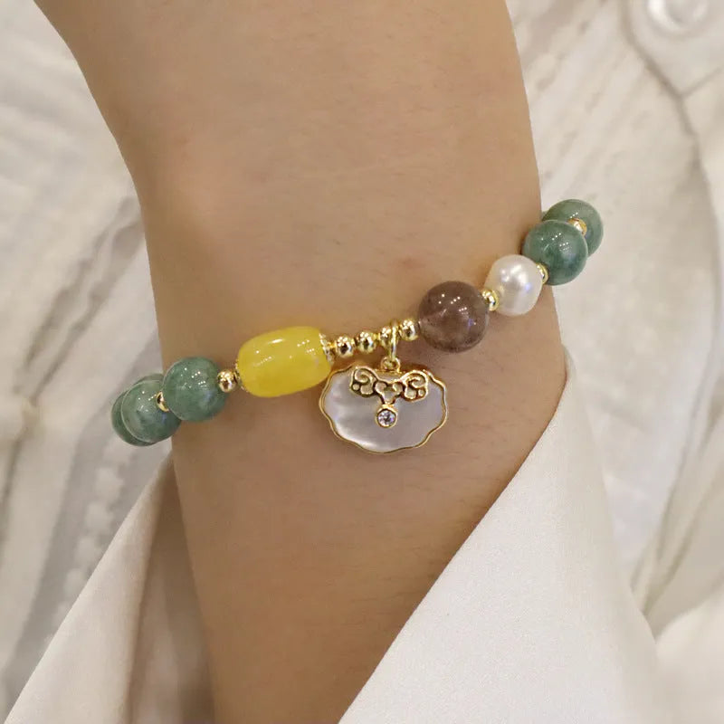 Natural green jade shell bracelet on a woman's wrist, casual style