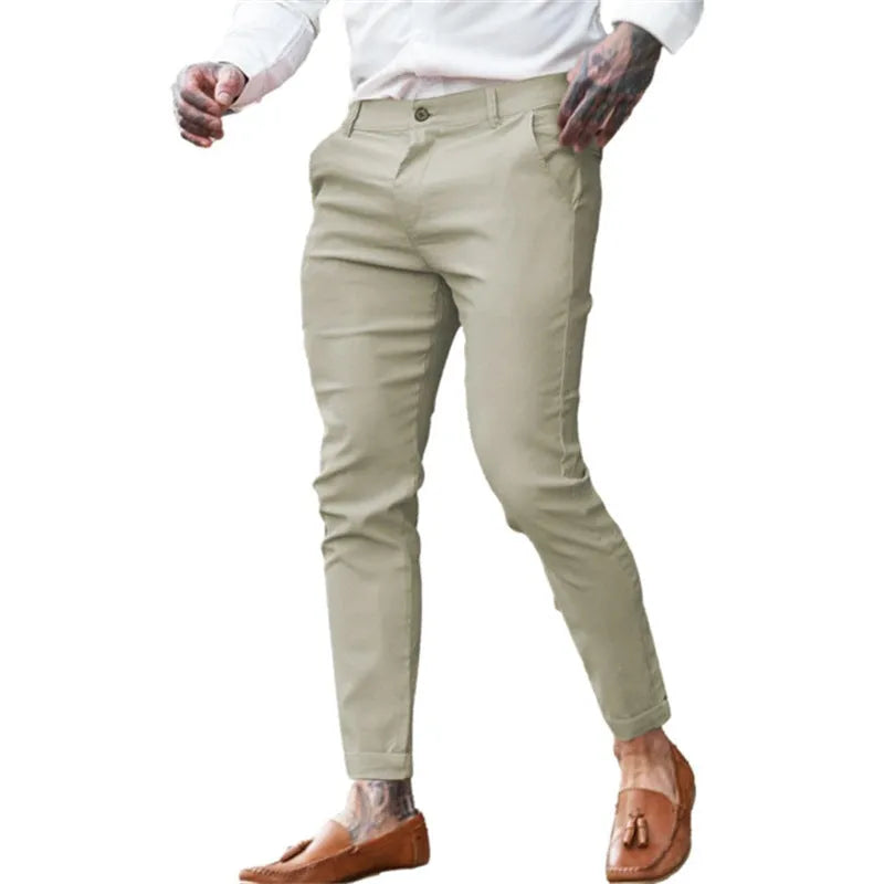 Men's slim fit pencil trousers in cotton twill stretch fabric on a hanger.