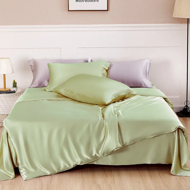 Solid colour silk duvet cover in Lotus Pink showing plain weave texture on a bed.
