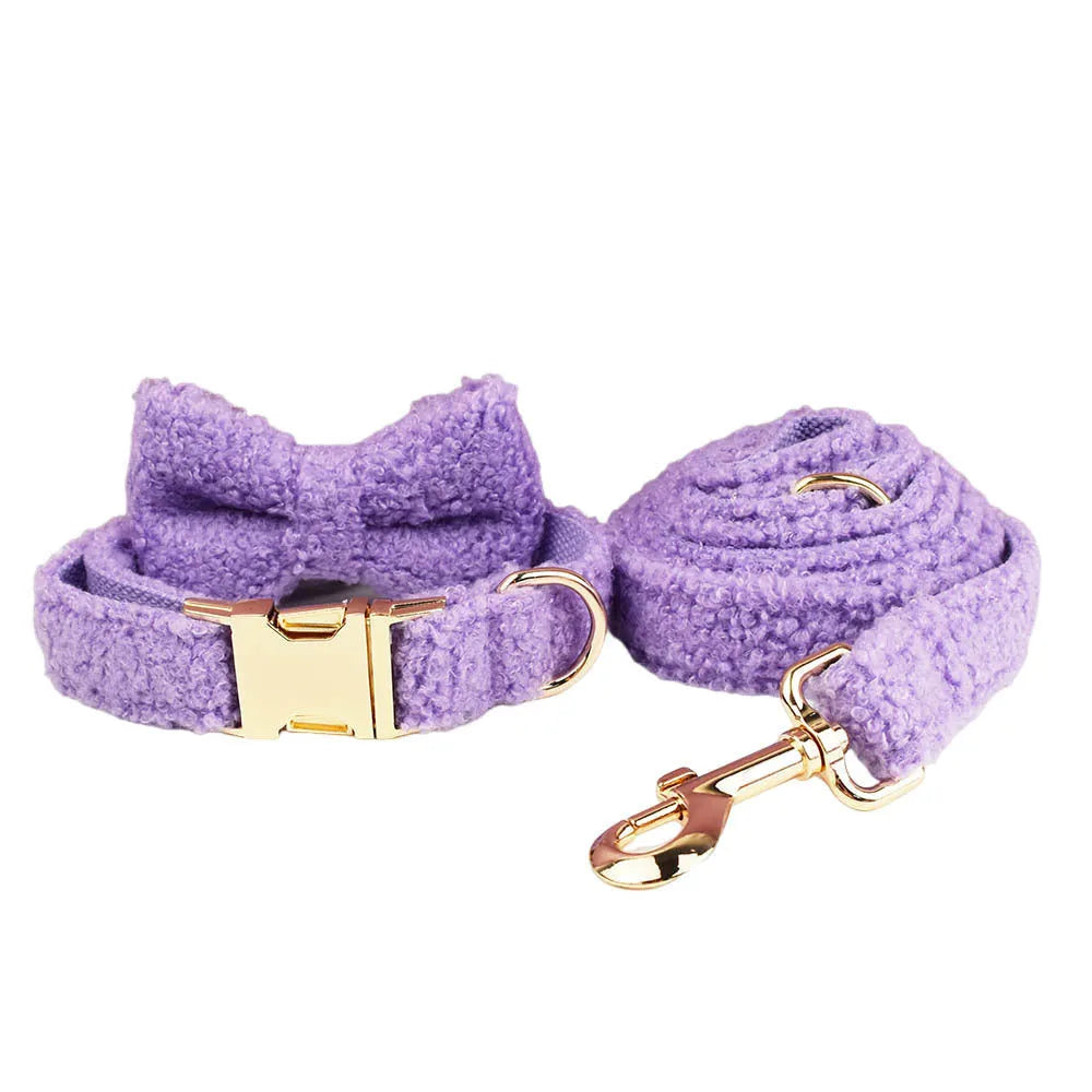 Purple cloth dog collar, leash, bow and vest four-piece set for small dogs on white background