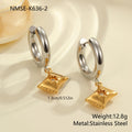 A pair of gold-coloured Christmas tree heart earrings for women, made from stainless steel with a star detail.