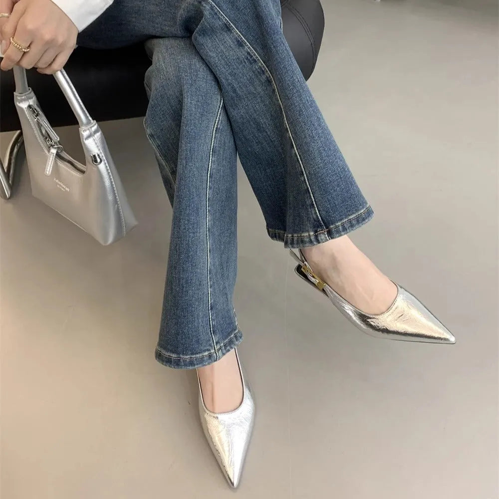 Thin low heel strap pointed leather shoes for women, black colour, side view showing heel height and ankle strap
