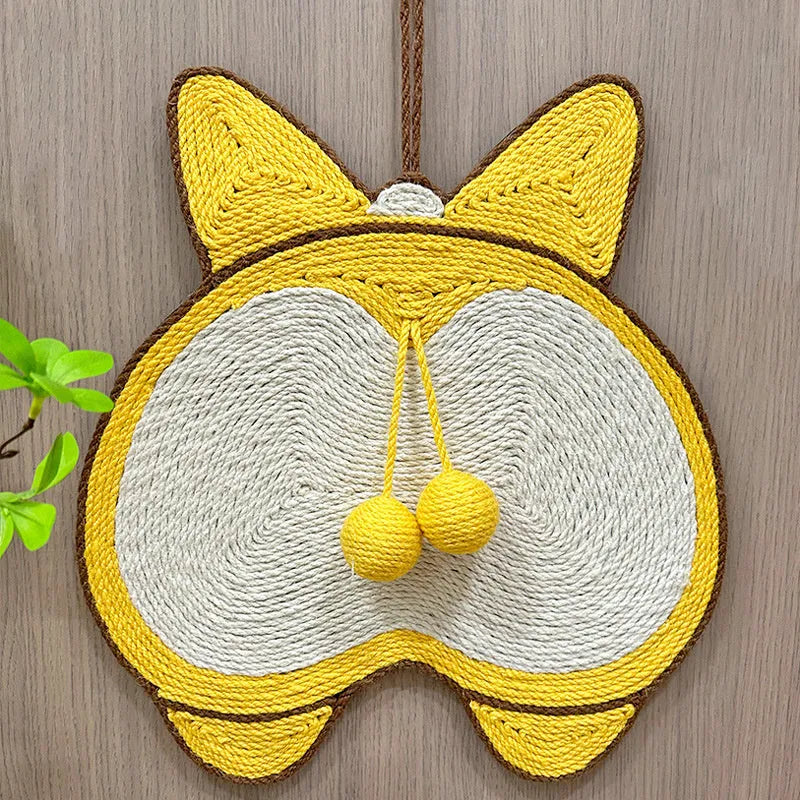 Yellow sisal cat scratching board with Corgi dog butt design, shown on a floor with a cat.