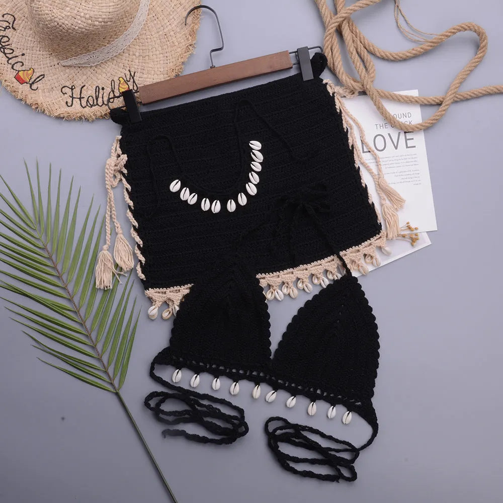 Women's black handmade shell design lace-up split bikini with matching short skirt.