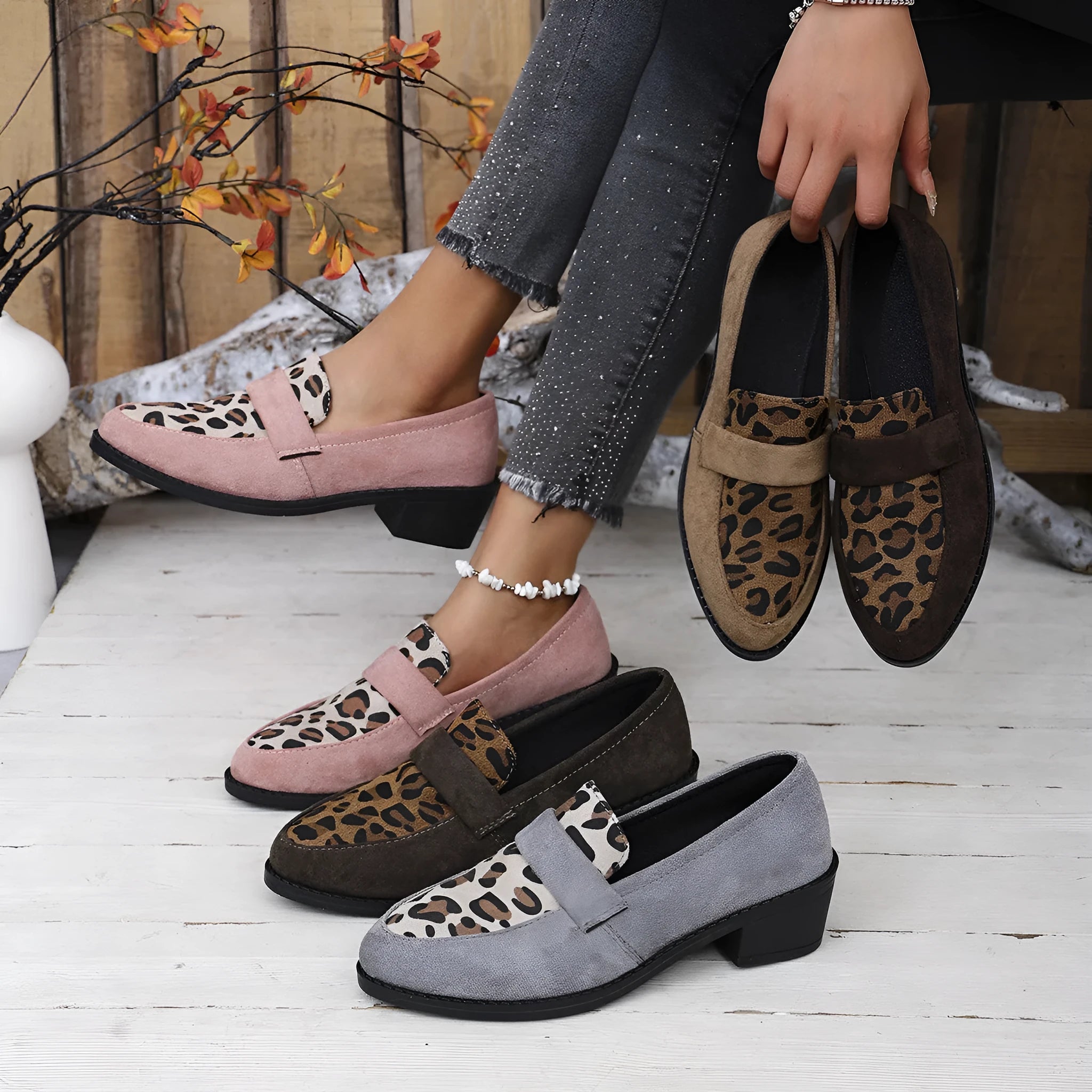 Women's brown leopard print suede slip-on shoes with chunky mid-heel and pointed toe on a white background.