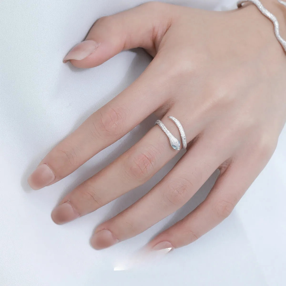 Adjustable silver snake ring with white gold electroplated finish showing detailed serpent modelling