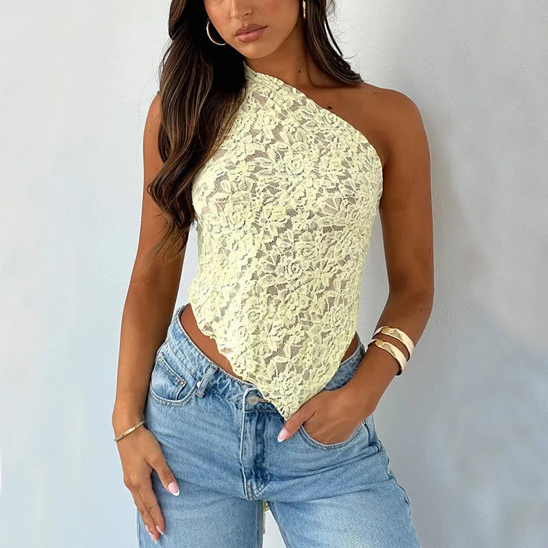 Women's apricot backless sleeveless top with lace trim and asymmetrical sloped neckline.