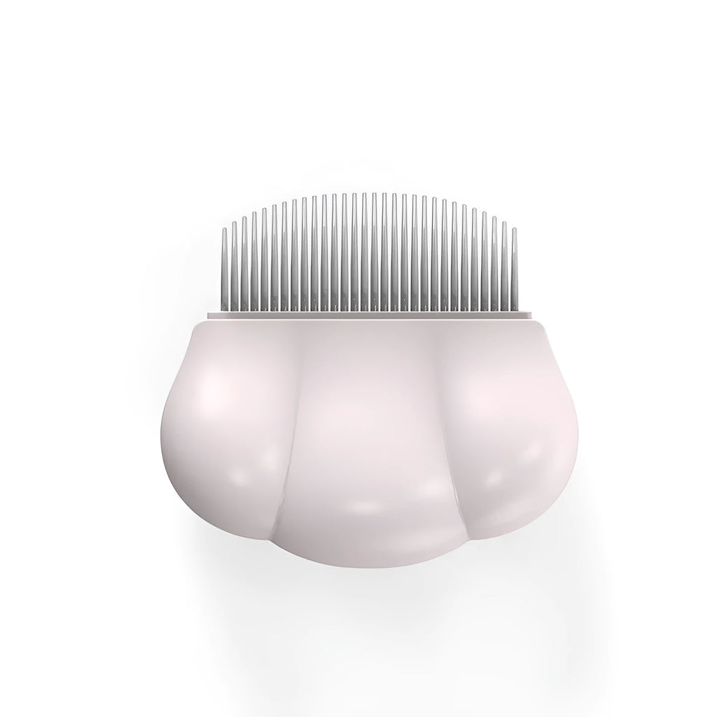 Paw Soft deshedding grooming brush for cats and dogs on a white background.
