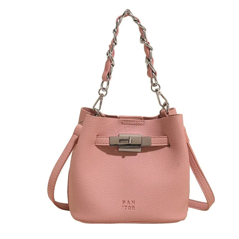 Soft PU retro bucket bag with chain detail on woman's shoulder