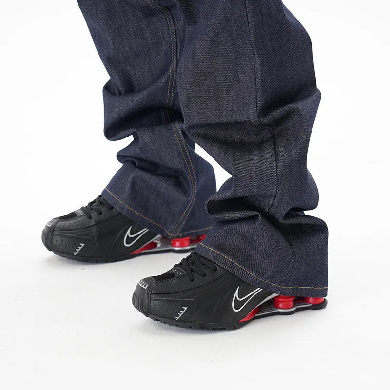 Casual loose straight original jeans in dark blue denim fabric, front view, showing loose straight leg cut.
