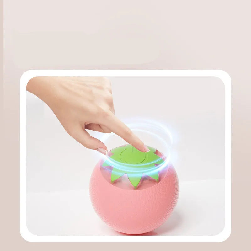 Automatic rolling ball toy for dogs and cats in green colour on floor