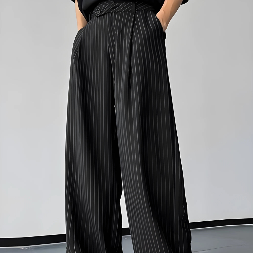 Men's black vertical striped pleated casual trousers showing elastic fabric and detailed sizing