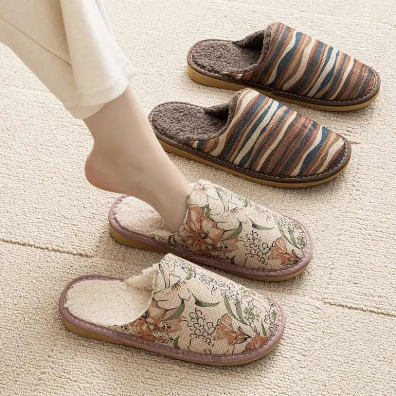 Warm winter linen surface cotton slippers with PVC sole, red flower colour, size 27cm on a wooden floor