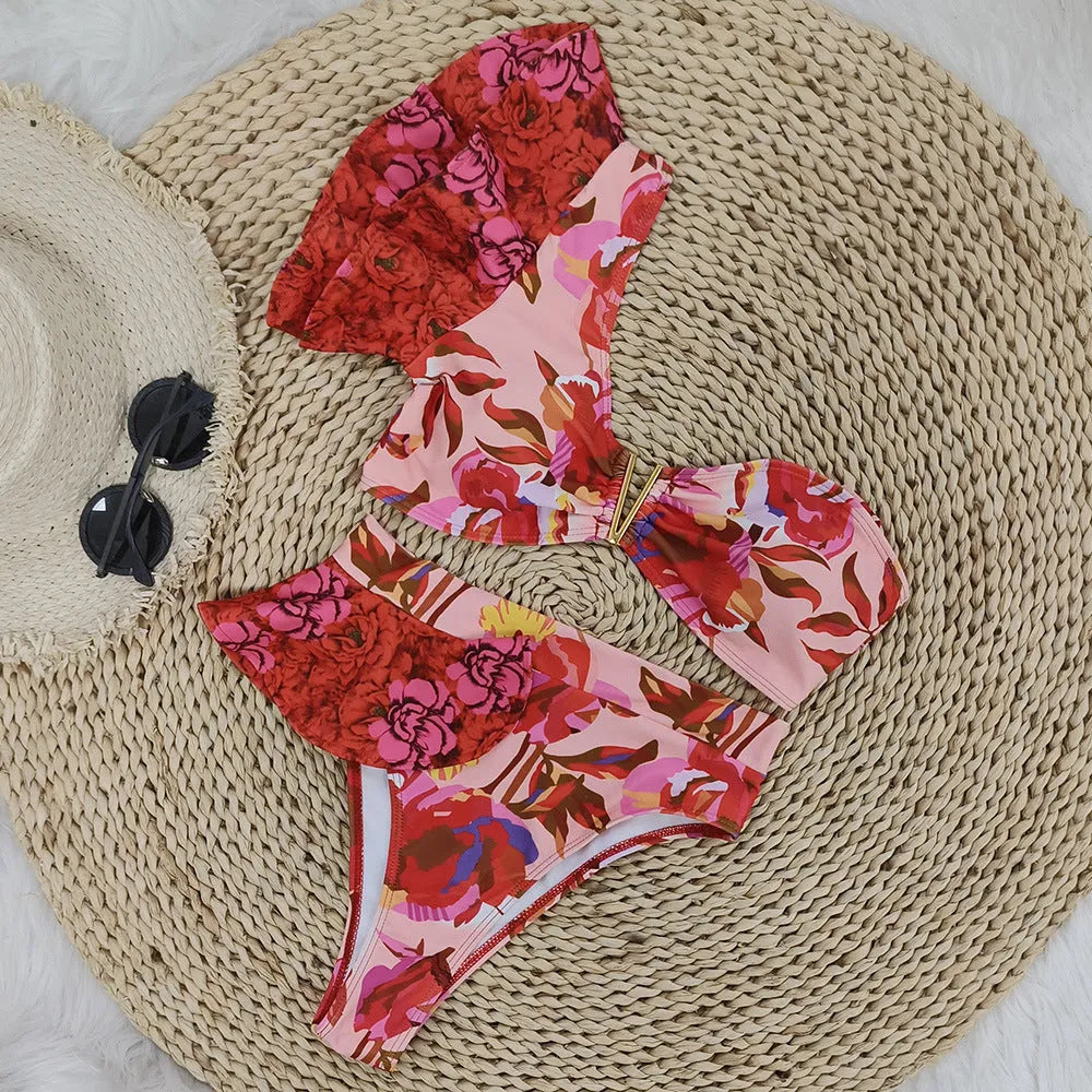 Women's pink floral print bikini with one-shoulder ruffled design and high-waisted briefs