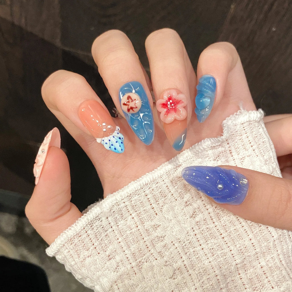 Three-dimensional carved jellyfish design on plastic wearable armour set in almond nail colour.