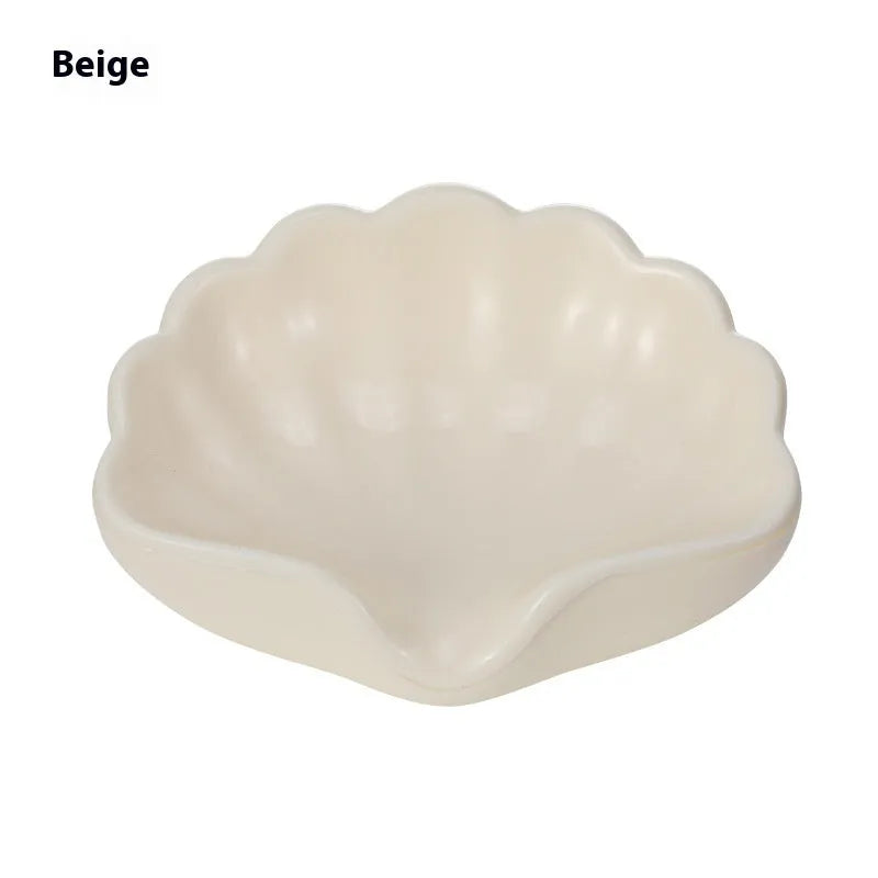 Plastic shell soap dish in Pearl White or Cherry Blossom Pink measuring 12x9x5.5cm for bathroom use