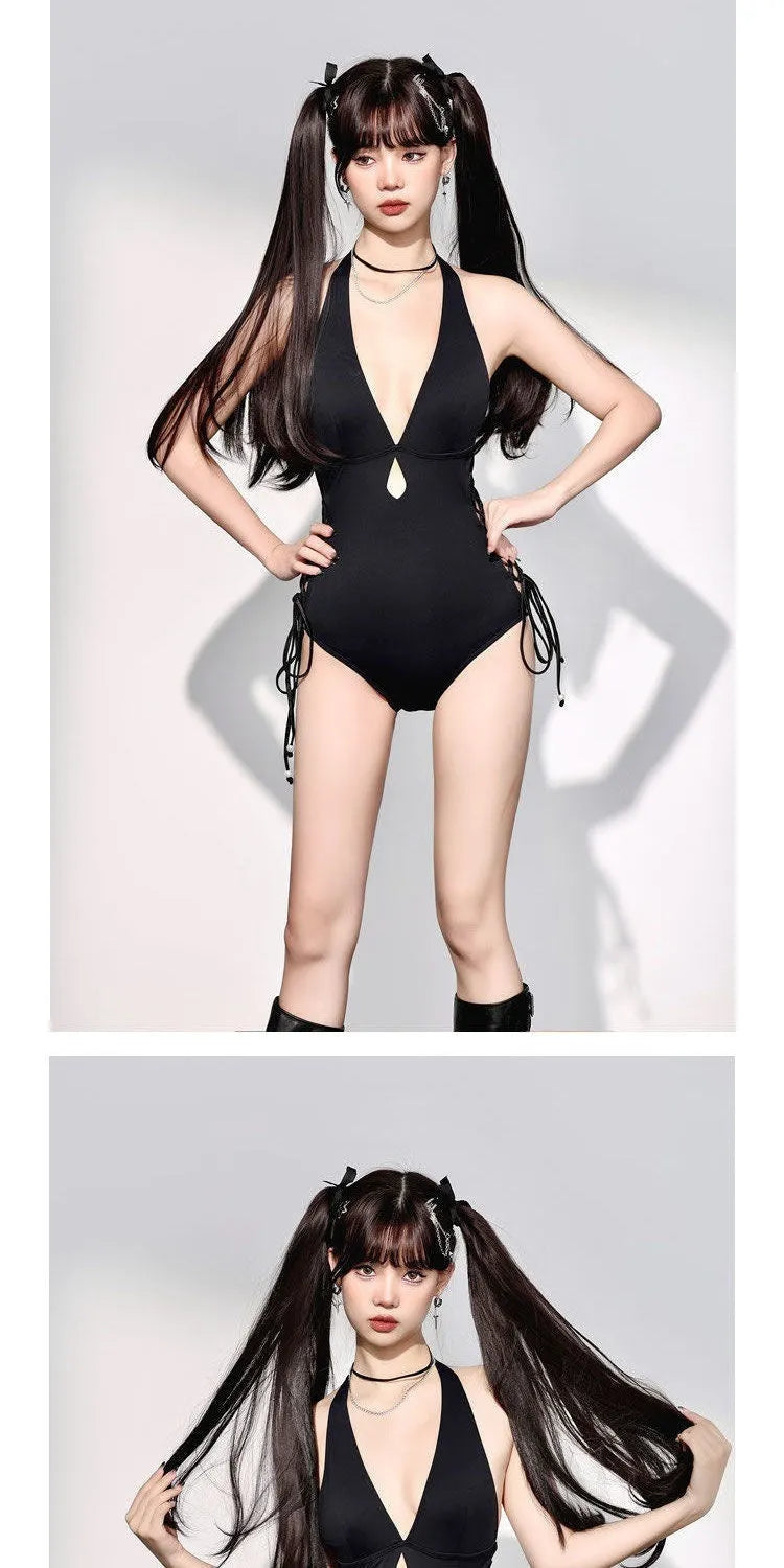 Women's black V-neck hollow strap niche one-piece swimsuit on plain background