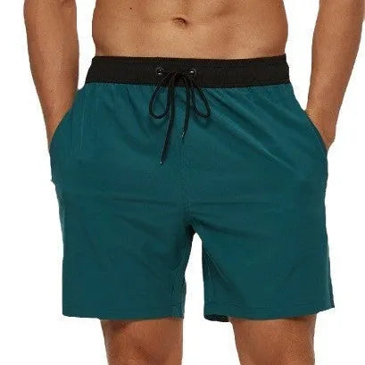 Men's blue running shorts with a drawstring waistband and a side headband pocket.