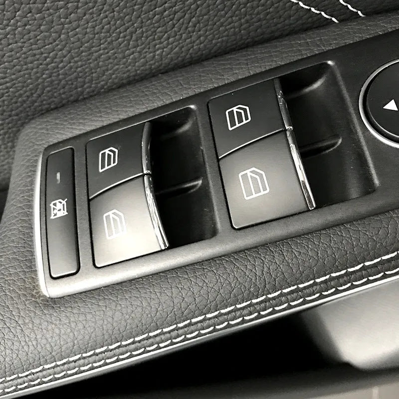Black glitter decorative sticker for a car window lift button on a door panel
