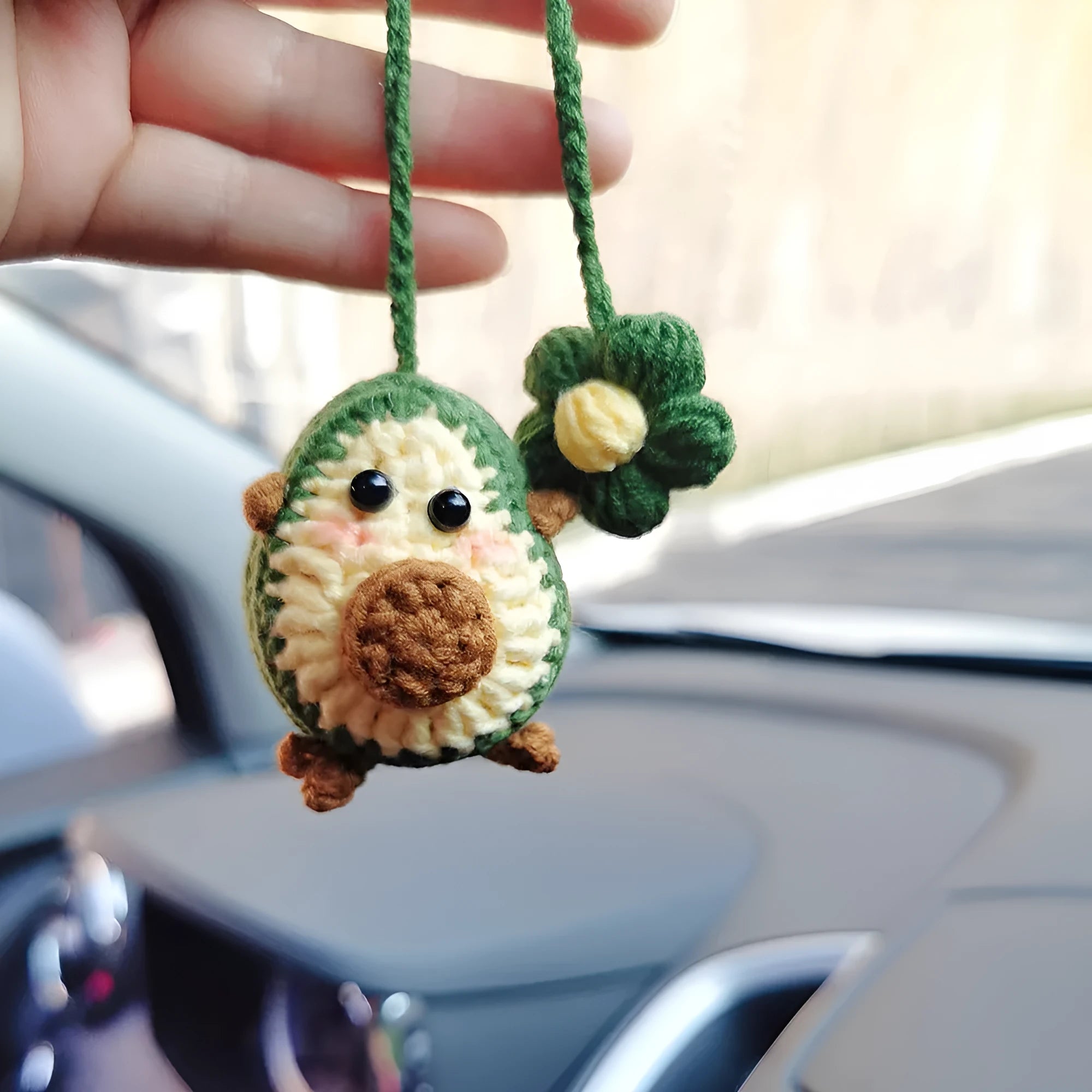 Handmade wool crocheted car pendant in avocado, pink rainbow, and red rainbow colour options