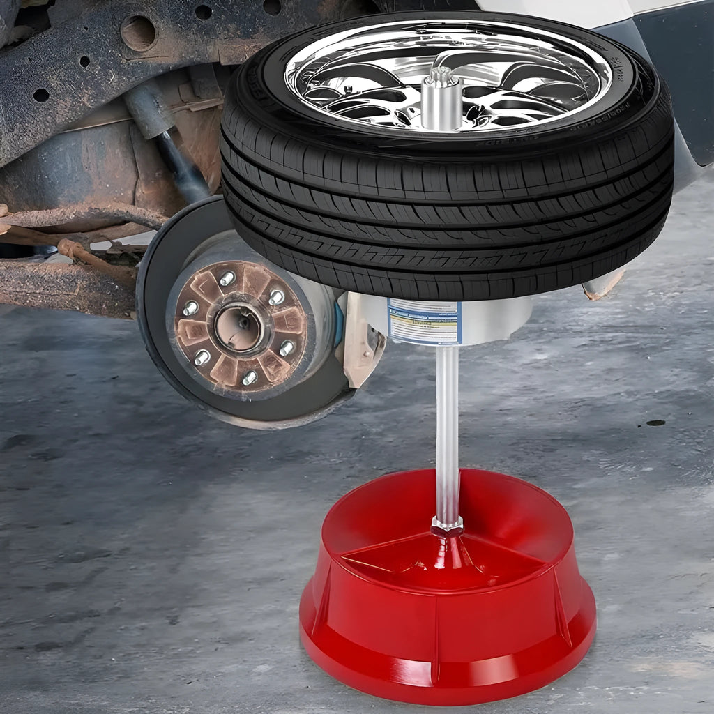Portable manual hub balancer with aluminium head and bull's eye level on enamel base.