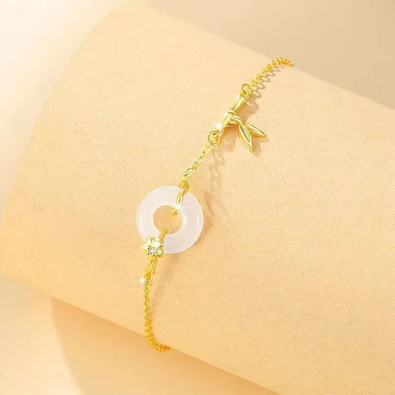 White chalcedony bracelet with peace buckle in silver gold electroplated finish on silver base
