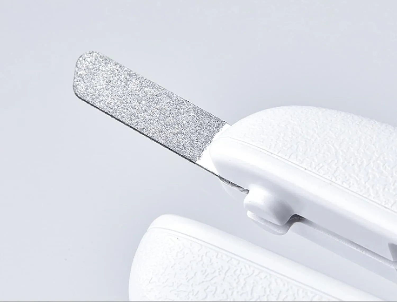 White pet nail clippers with LED light, transparent anti-splash guard, and a leather-like handle.