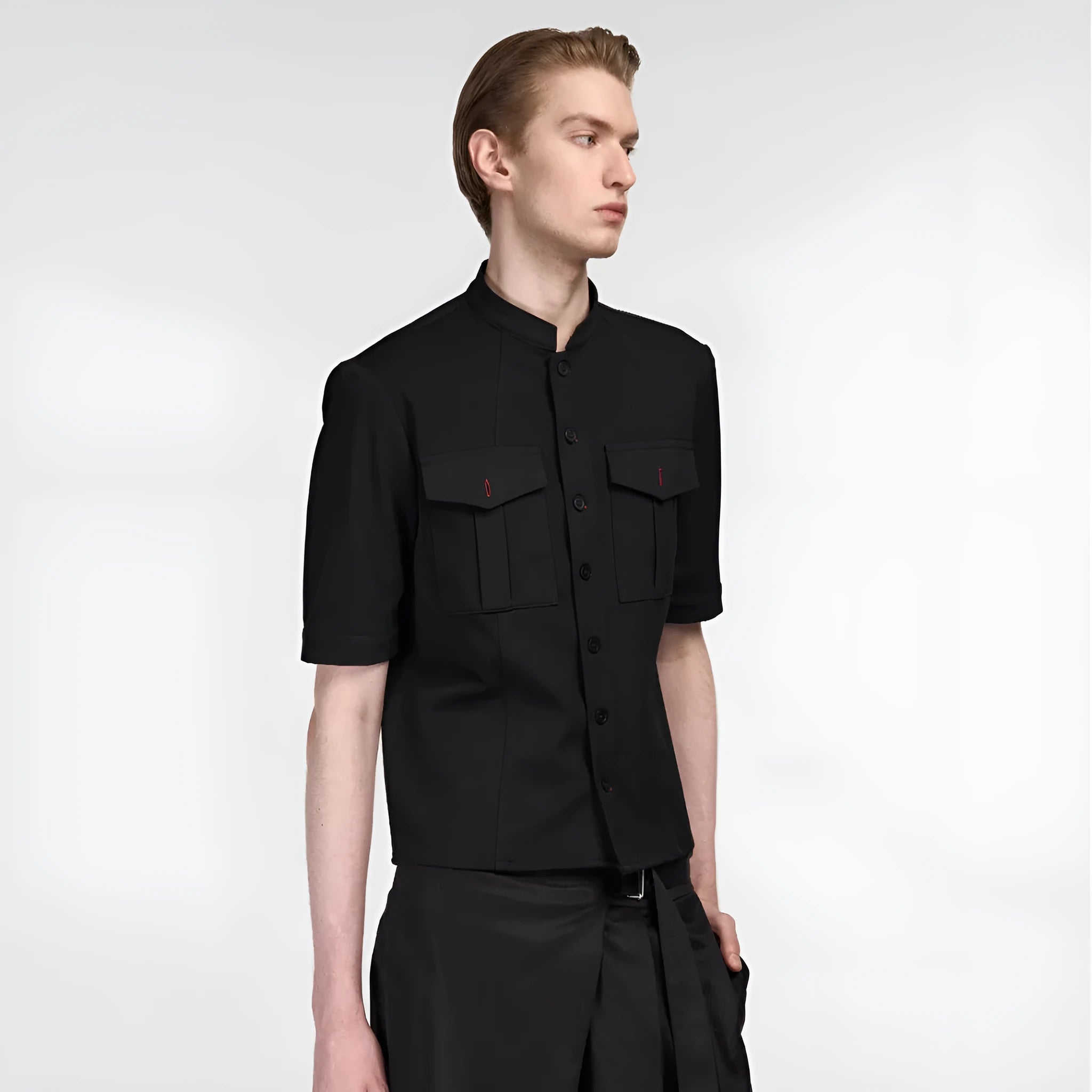 Handmade black loose fit half sleeve hunting shirt with a shirt collar, laid flat.