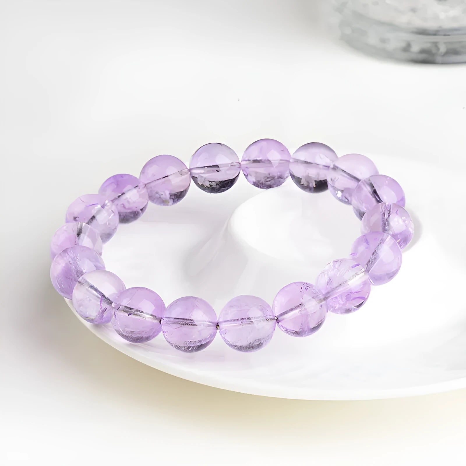 Lavender amethyst crystal bracelet with round beads showing water ripple pattern in light purple colour