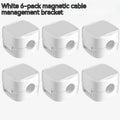 White and black cable clips holding under desk wires including USB and HDMI cables