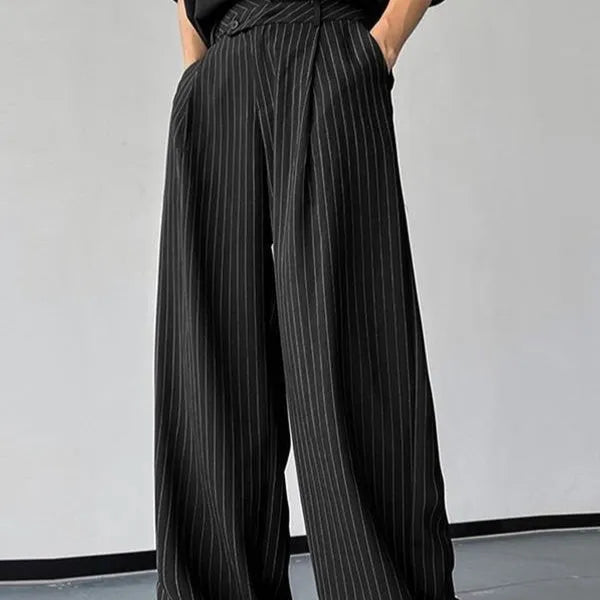 Men's black vertical striped pleated casual trousers showing elastic fabric and detailed sizing