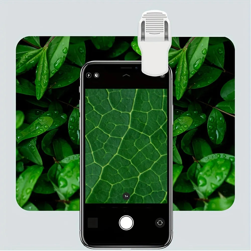 Mini mobile phone microscope with 60x magnification, LED light, and universal clip attached to a smartphone camera