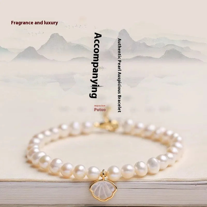 Women's freshwater pearl bracelet with fan-shaped pearl cluster and choice of elastic or chain fastening.