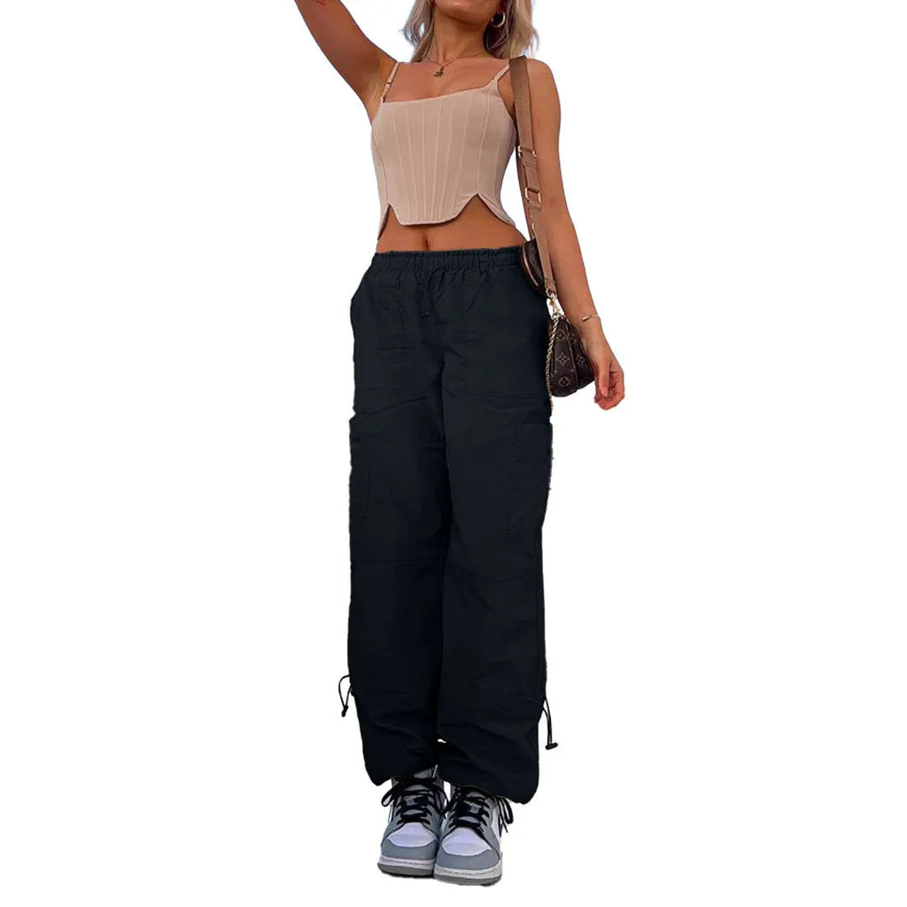 Men's loose-fit straight-leg cargo trousers in khaki with multiple pockets, showing the relaxed silhouette.