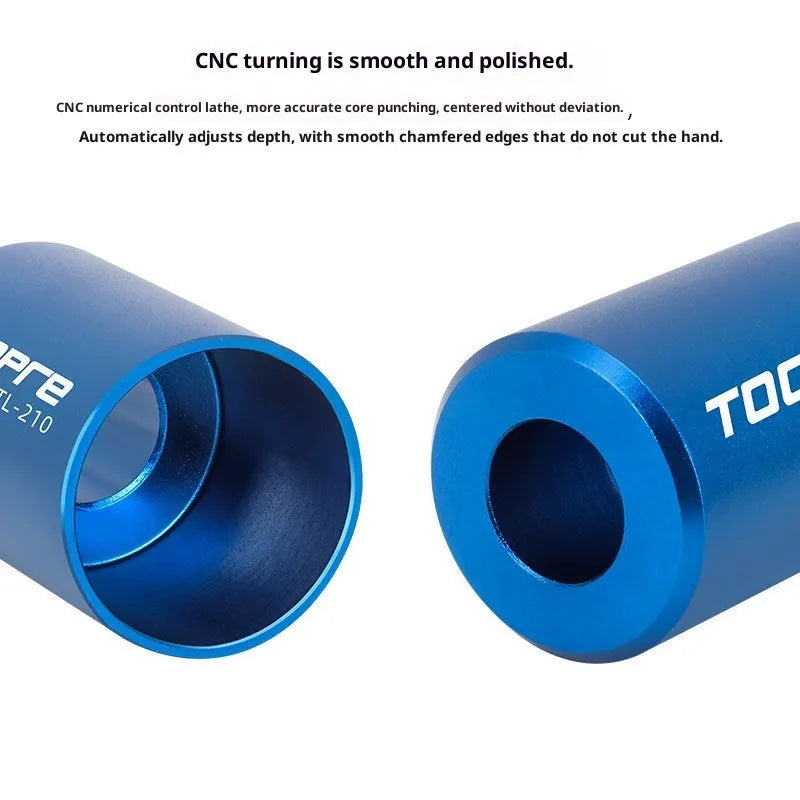 Blue sunflower driving tool for bicycle bowl group hanging core installation, made from aluminium alloy and stainless steel, on a workbench.