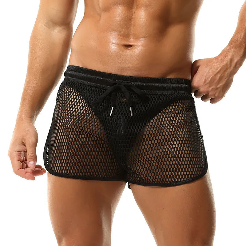 Men's loose breathable polyester boxers in solid colour, black, front view on plain background