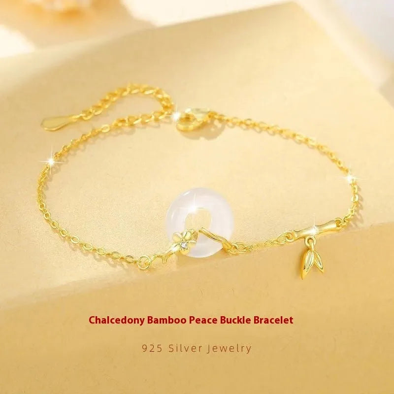 White chalcedony bracelet with peace buckle in silver gold electroplated finish on silver base