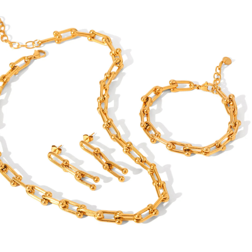 Stainless steel jewellery set including a necklace with titanium steel pendant, bracelet, and earrings in a matching colour