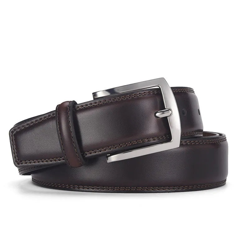 Men's black genuine leather belt with a silver alloy pin buckle on a plain background.