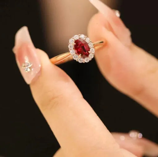 Gold Pigeon red blood gemstone silver-plated ring with floral design on white background