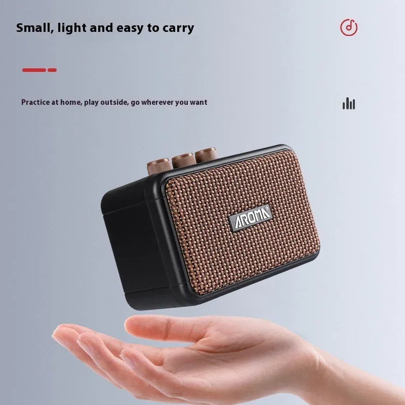 AG04 mini portable electric guitar loudspeaker box in plastic casing with data cable