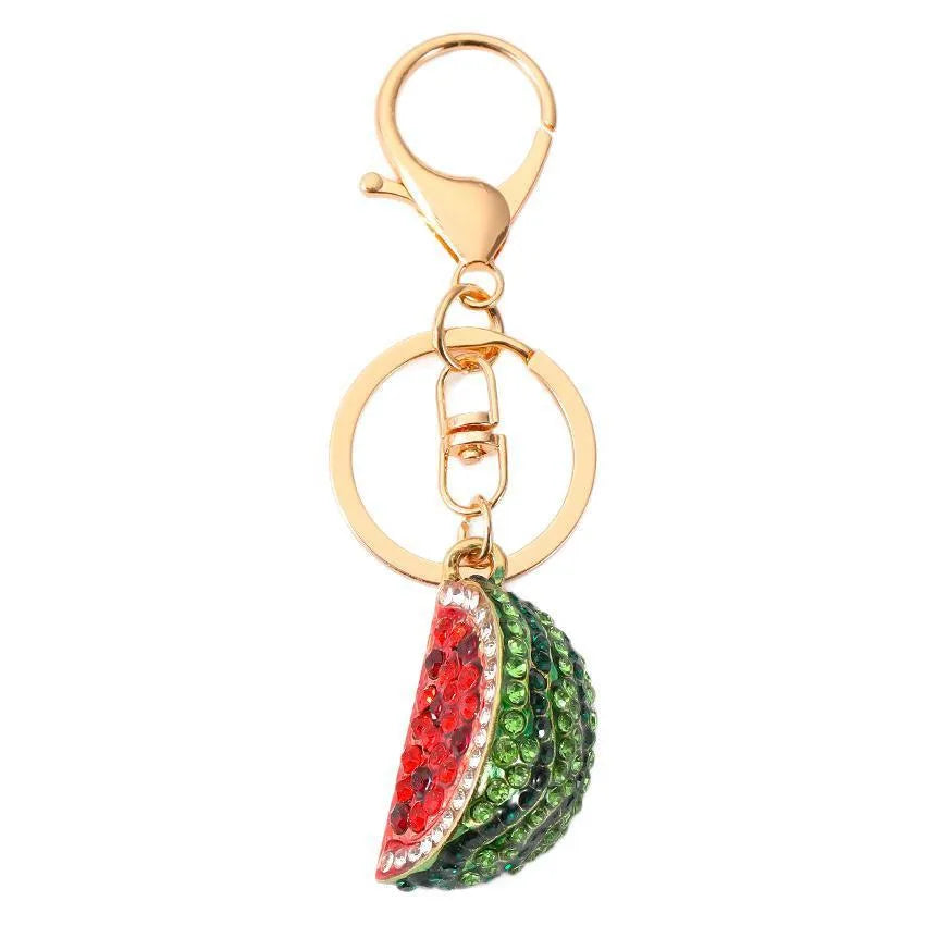 Creative watermelon shape metal car keychain in red on a white background