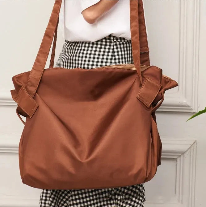 Large capacity shoulder crossbody luggage bag for women in black Oxford cloth with solid colour design