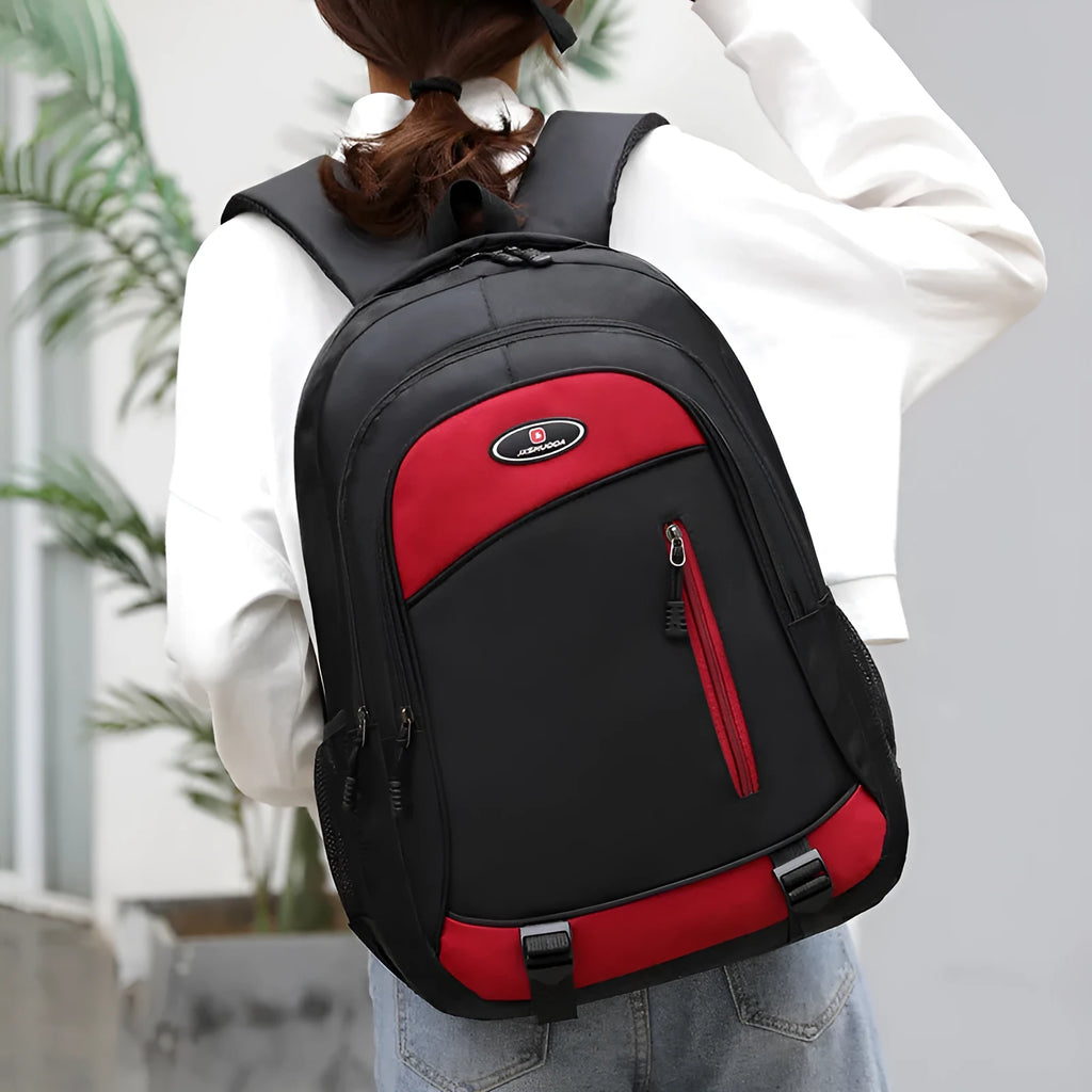 Waterproof nylon school backpack with airpillow straps, available in black, red, blue, and gray