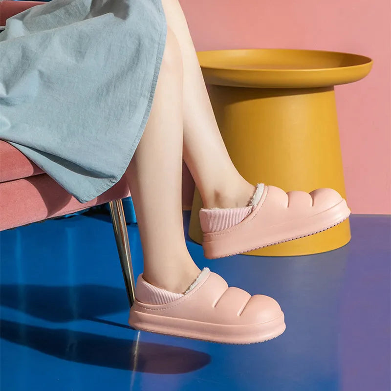 Women's waterproof EVA winter house slippers in multiple colours with plush lining and non-slip sole.