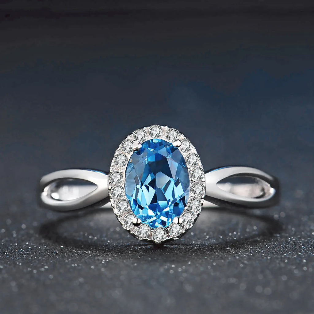 925 sterling silver geometric jewellery set with blue topaz stones including earrings, ring, bracelet and necklace