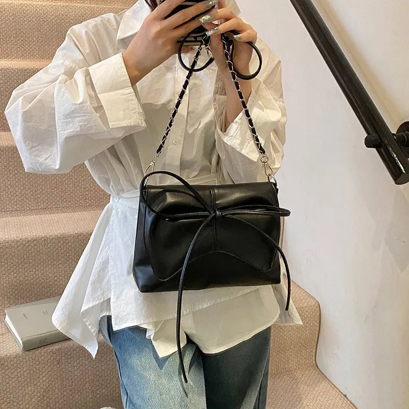 Women's black PU leather underarm bag with horizontal square design and crossbody strap