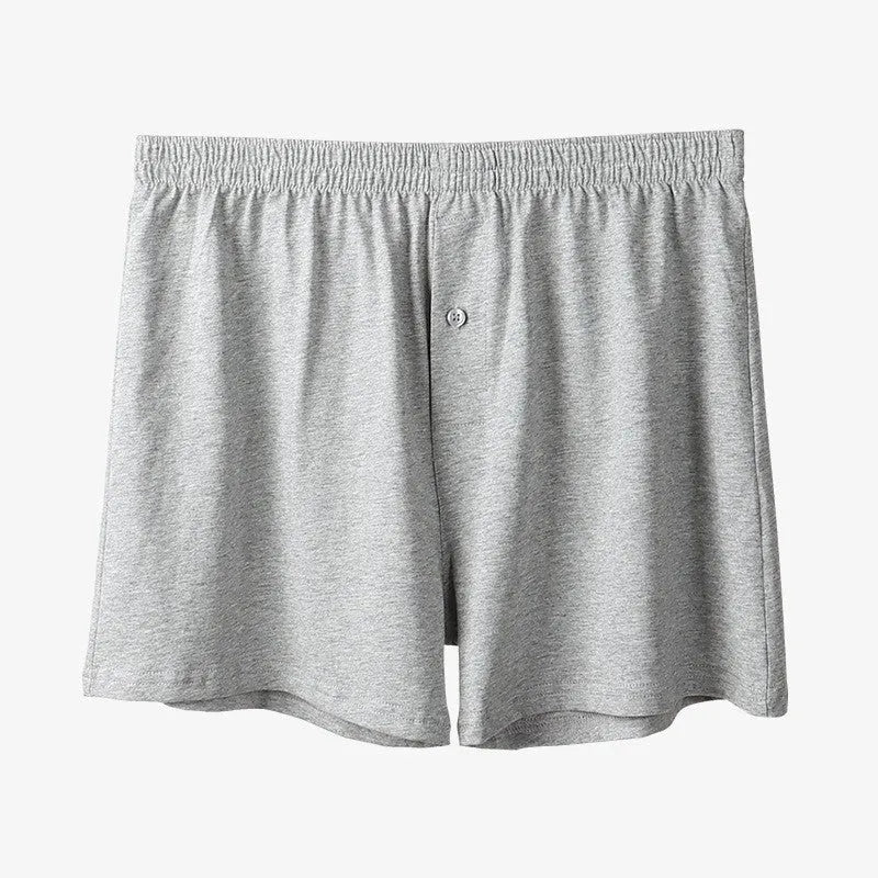 Men's high waist cotton boxer shorts in loose fitting design showing solid colour options